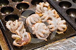 Close up of Takoyaki with squid, Making Takoyaki by big squid select focus