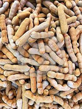 Close up of tamarind for sale at market .