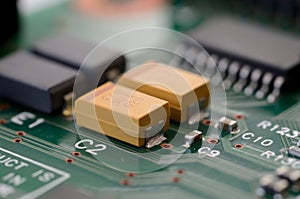 Close up tantalum capacitors on PCB photo