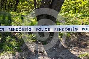 a close-up with a tape with the inscription Police in English and Hungarian language