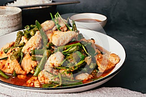 Close up, Tasty Stir-fried pork and red hot curry paste with or long bean and Ingredients are oyster sauce, fish sauce, sugar,