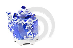 Close-up of a tea kettle with a tea cup