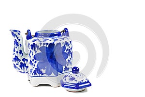 Close-up of a tea kettle with a tea cup