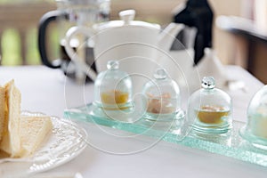 Close up of tea time set with jam on table