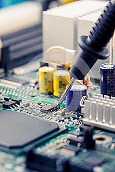 Close Up - Technician engineer measuring multimeter computer circuit board motherboard