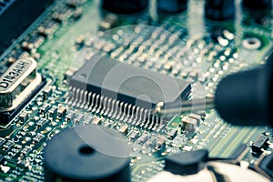 Close Up - Technician engineer measuring multimeter computer circuit board motherboard