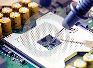 Close Up - Technician engineer measuring multimeter CPU socket computer motherboard