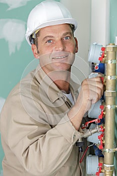 close up technician inspecting heating system