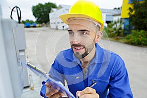 close-up technician reading outdoor meter