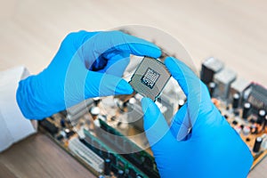 Close up of technician scientist hand holding CPU`s personal com
