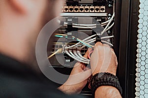 Close up of technician setting up network in server room