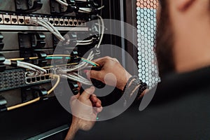 Close up of technician setting up network in server room