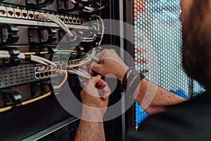 Close up of technician setting up network in server room