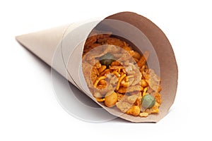 Close up of Teekha Meetha crunchy spicy Indian namkeen snacks In handmade  handcraft  brown paper cone bag