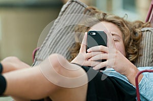 Close up of teen boy on cell phone