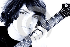 Close Up of Teen Boy With Electric Bass Guitar Over White