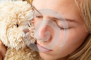 Close up teenage girl with cuddly toy