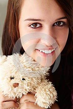 Close up teenage girl with cuddly toy photo