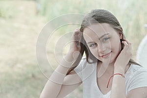 Close up of teenage girl smiling to the camera. Education, school girl. Smiling young woman.