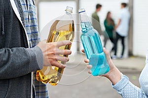 Close Up Of Teenage Group Drinking Alcohol