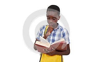 close-up of a teenager reading a book, pensive