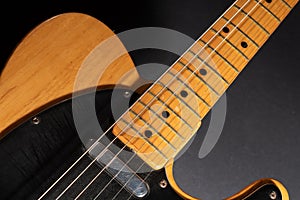 Close up of a Telecaster natural electric guitar