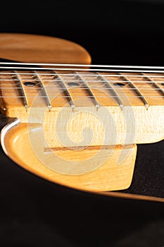 Close up of a Telecaster natural electric guitar