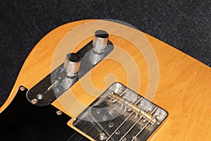 Close up of a Telecaster natural electric guitar