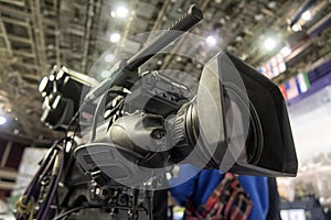 Close-up television camera at sports competitions, TV broadcasting.