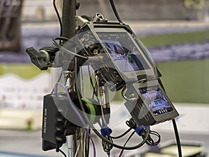 Close-up television camera at sports competitions, TV broadcasting.