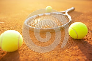 Close up of tenning racket and balls on the tennis clay ground or court, sport concept