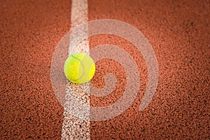 Close up of tennis ball on clay court./Tennis ball