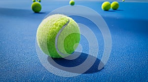 A close-up of the tennis ball on the court. The blue background is a beautiful illustration and background. Close-up shots of tenn