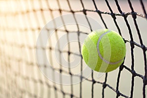 Close up tennis ball hitting to net on blur