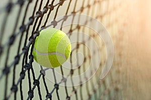 Close up tennis ball hitting to net on blur