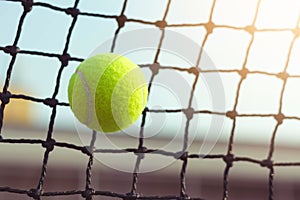 Close up tennis ball hitting to net on blur