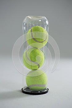 Close up of tennis ball in plastic bottle