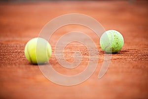 Close up of tennis balls on tennis court. Sport concept