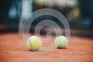 Close up of tennis balls on tennis court. Sport concept