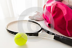 Close up of tennis stuff and female sports bag