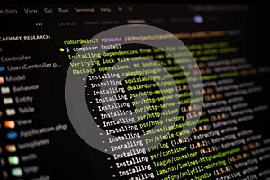 Close-up of terminal screen showing PHP Composer dependency installation for web development. Ideal for coding, software