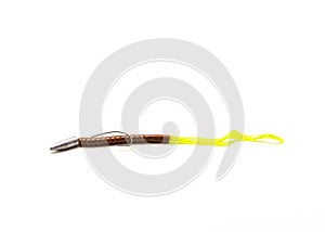 Close-up Texas rig with bullet sinker, glowing plastic worm and offset worm hook isolated on white