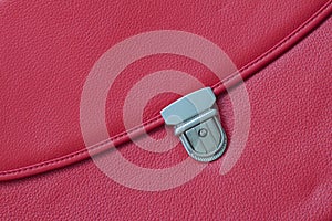 Close-up texture of briefcase, handbag from genuine leather with metal buckle or clasp lock. For background , backdrop