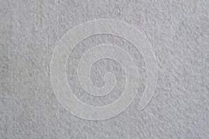 Close-up texture of natural white of suede or fabric. Cloth as background. Bright material for design