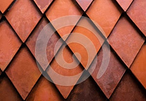 Close up texture of orange rhombus brick. Wall for exterior or interior design. Building material. Background concept