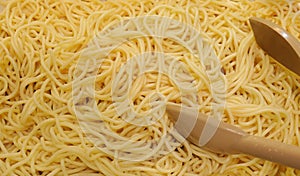 Close up texture of spaghetti pasta background.,texture shot of cooked spaghetti noodles plain