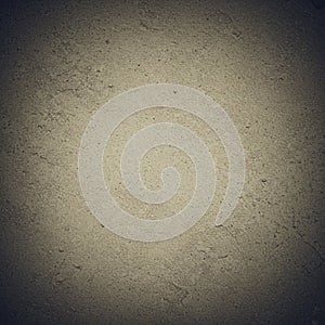 Close-up of a textured concrete wall surface, displaying a rough, grainy texture with