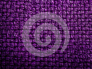 Close-up of Textured Purple Woven Fabric Showing Intricate Pattern and Depth. photo