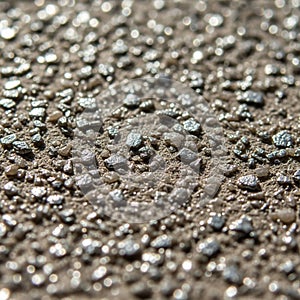 Close-up of a textured surface with small, irregularly shaped pebbles embedded in a concrete-like