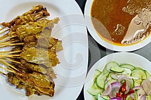 Close up Thai Pork Satay, Moo Satay Grilled pork served with peanut sauce or sweet and sour sauce - Asian food Concept style on